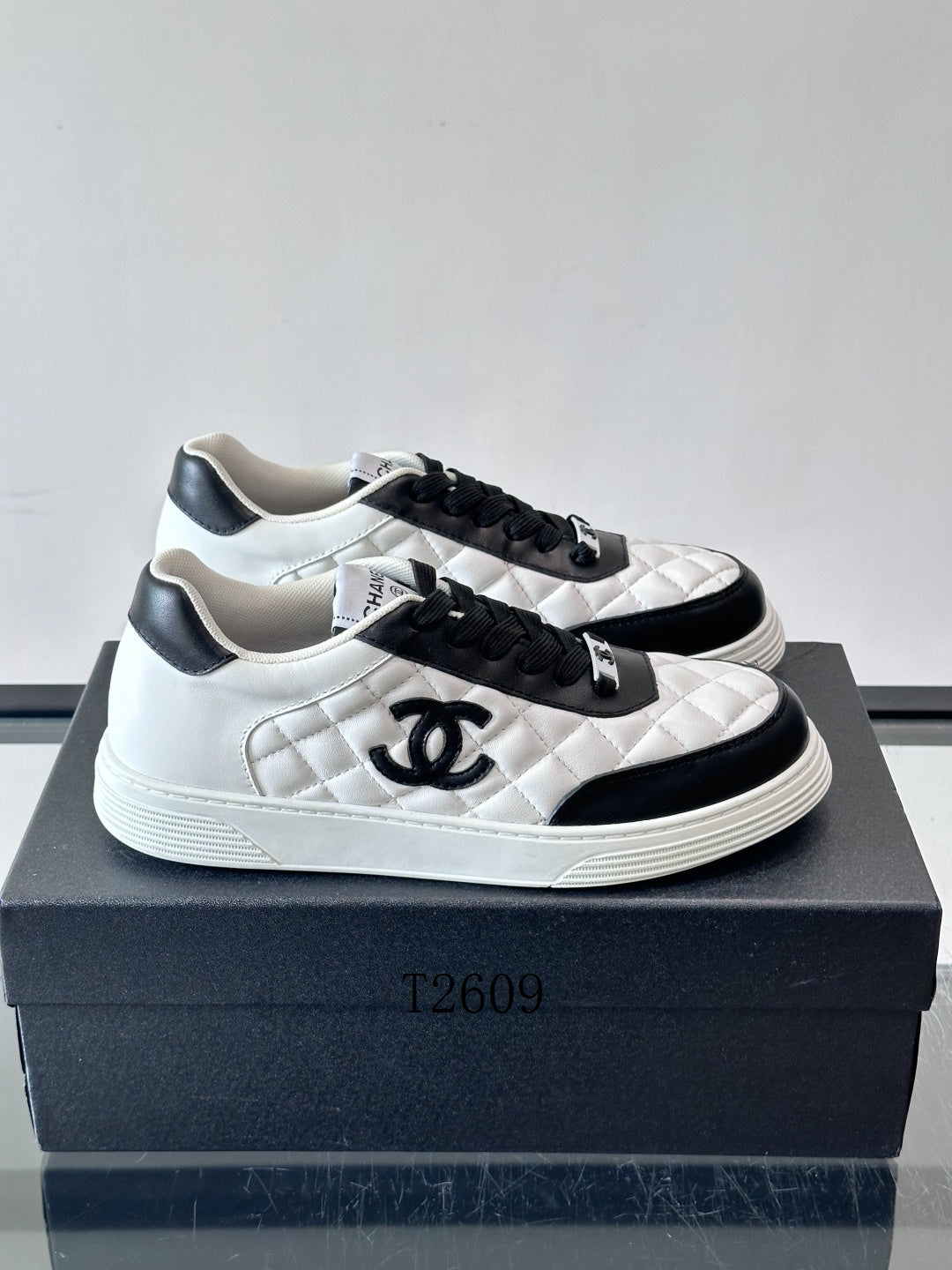 Chanel White & Black Quilted Low-Top Sneakers